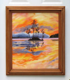 Original oil painting of a colorful pastel sky, the oranges, yellows and pinks contrast with the distant hills rising out of the mist and the dark silhouetted island and trees reflected in calm waters 24" tall by 20" wide framed