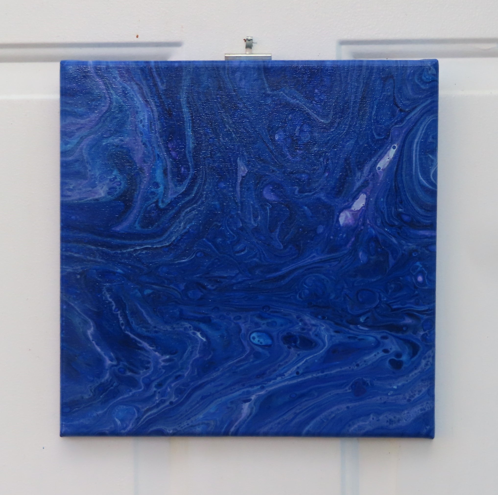 abstract acrylic liquid art on 12x12" canvas, rich blues, purples and white accents