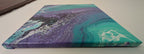 abstract liquid acrylic paint on 12x12" canvas, blues, greens and purples mix and flow in endless movement, can display in various directions, top side