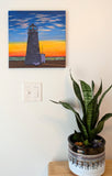 original oil painting, sunset, wispy clouds, ocean, lighthouse, unframed, displayed over table