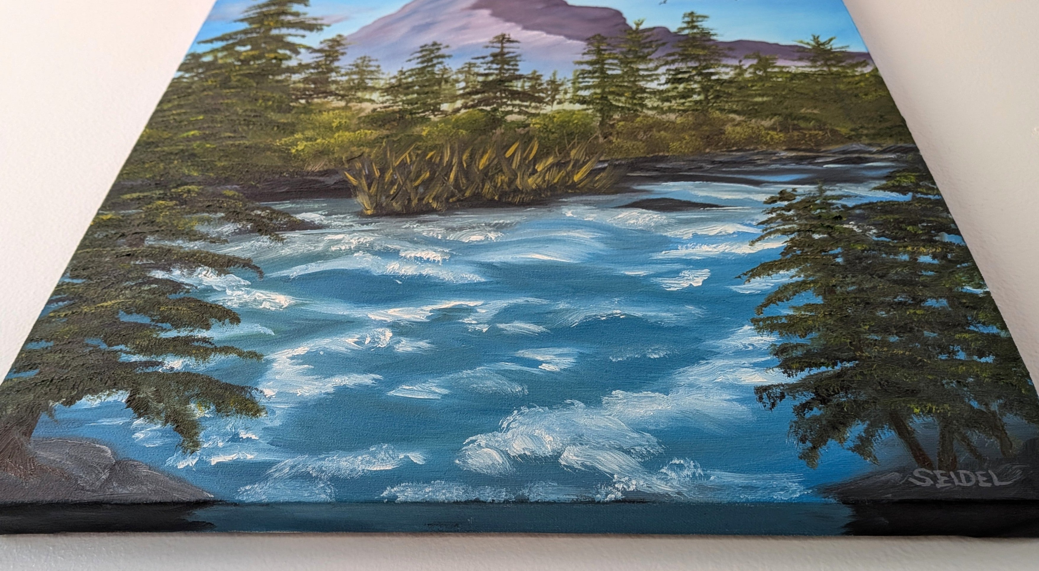 original oil painting, mountain, rushing river, evergreens, unframed, close-up from bottom painted side with artist signature