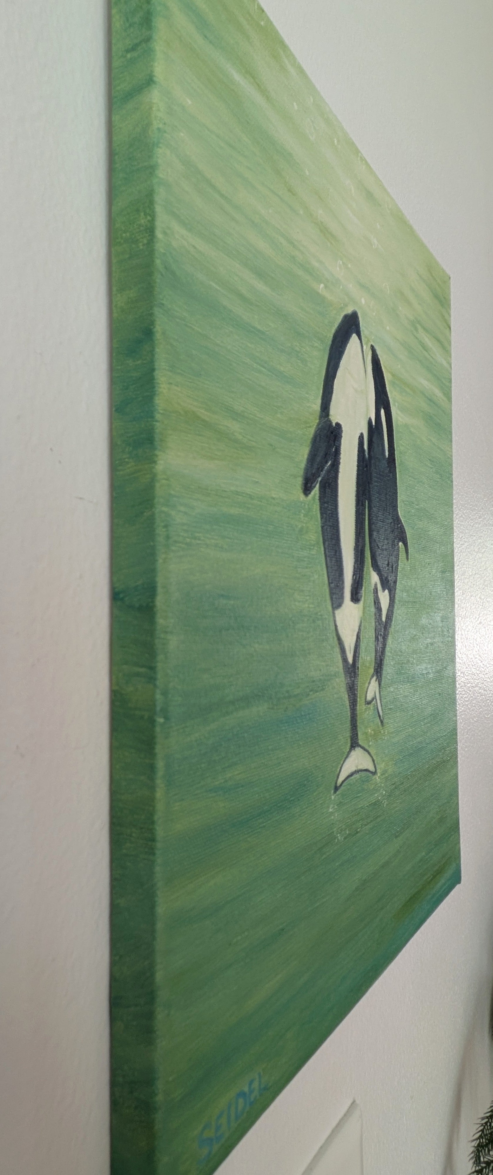 original oil painting, two orca whales  seem to dance to the surface of the ocean, unframed, showing painted left side