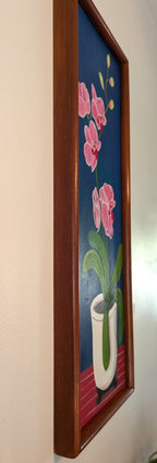 original oil painting on board of pink orchids against a royal blue background, in a white pot, framed in a handmade red chestnut colored frame, a left side view to show the depth of the frame
