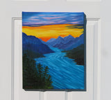 16x20 oil painting of river rushing through the mountains under a sunset sky