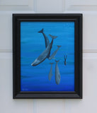 11x14 original oil painting of a scuba diver swimming with whales, framed in black