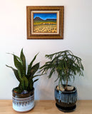 Wild Mustangs in countryside acrylic Painting on canvas board in ornate frame, after Maynard Dixon, displayed over table