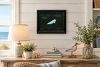 11x14" Original oil painting of a beluga whale in emerald colored ocean, framed, displayed in a seaside cottage