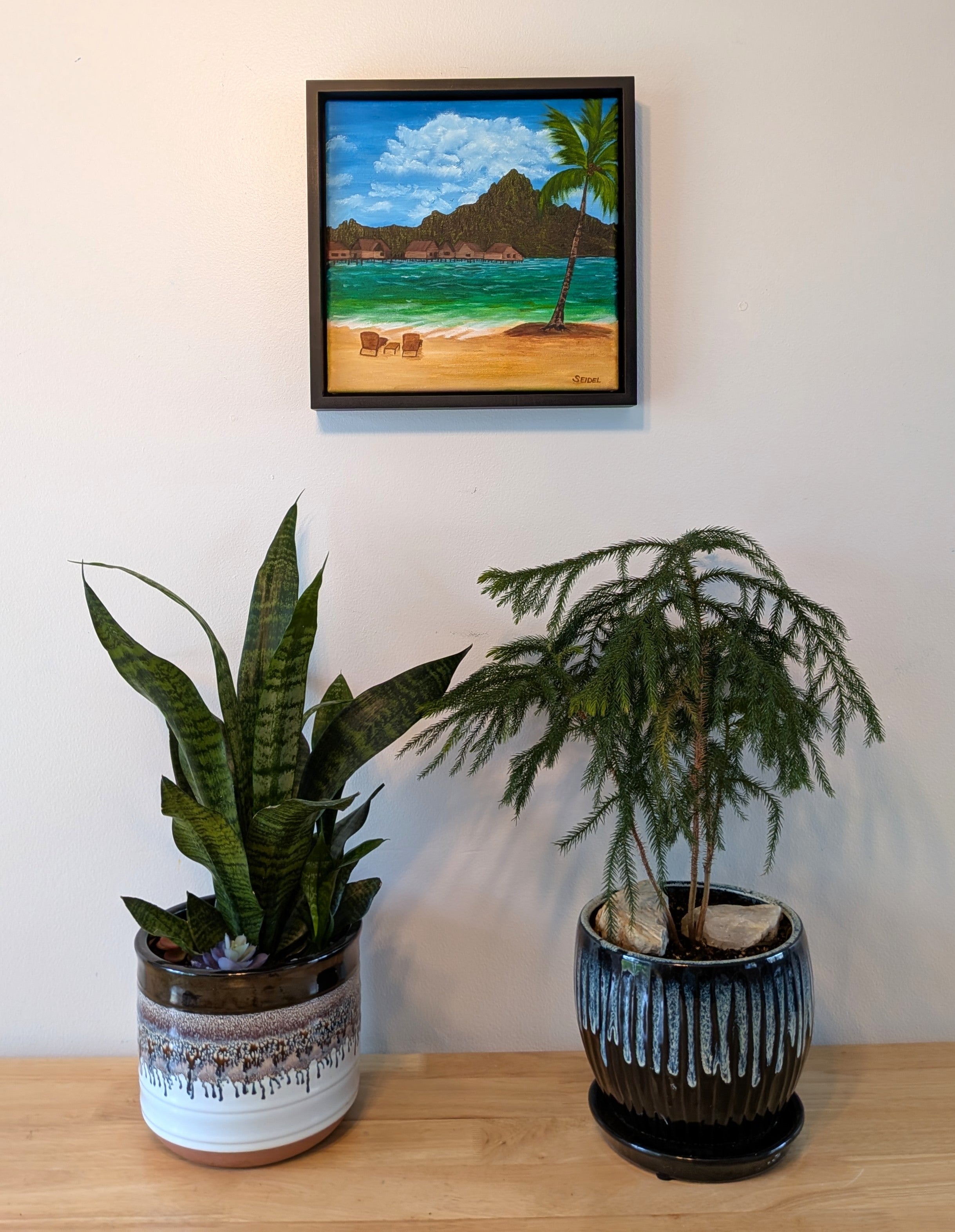 original oil painting of Bora Bora with iconic mountain view from beach, framed, displayed on wall over table