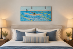 12x24" original oil painting of a swimmer performing butterfly stroke, shown over a bed