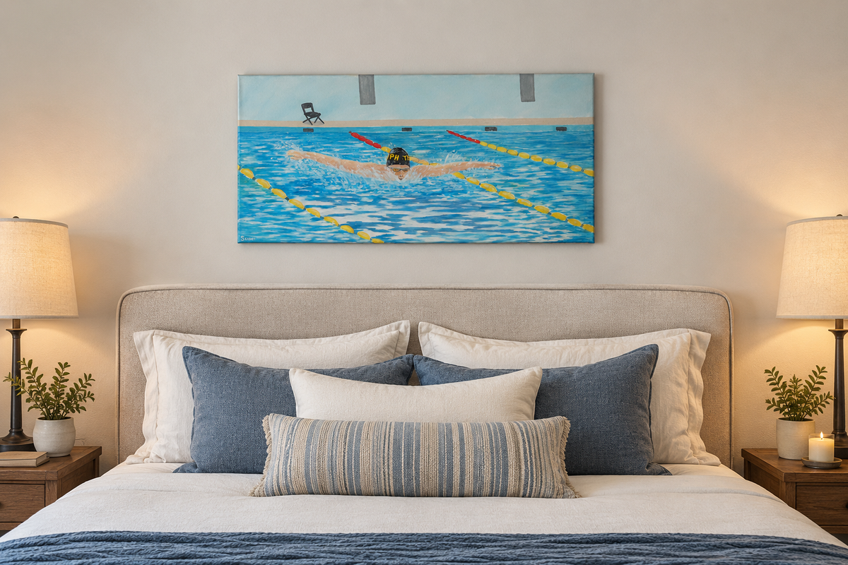 12x24" original oil painting of a swimmer performing butterfly stroke, shown over a bed