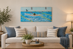 12x24" original oil painting of a swimmer performing butterfly stroke, shown over a sofa