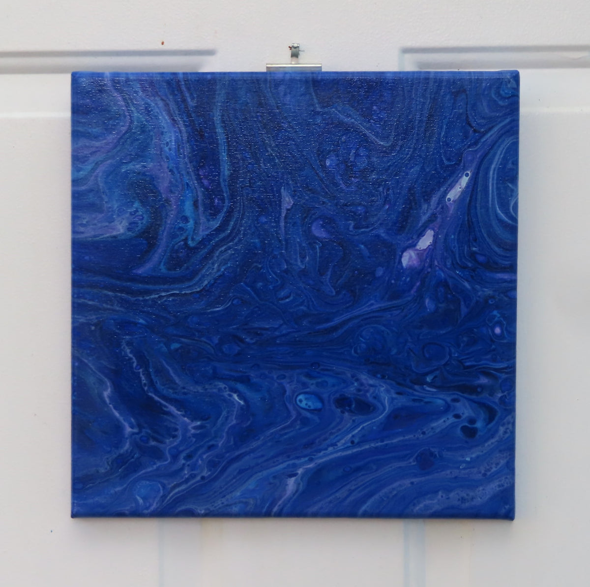 abstract acrylic liquid art on 12x12" canvas, rich blues, purples and white accents. Can be displayed in any direction