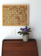 17x21" original wood framed corkboard, handmade with real wine corks, many from local Missouri wines. Blond wood, with a solid wood backboard. Sells with ideally sized pushpins. Shown over a secretary desk.
