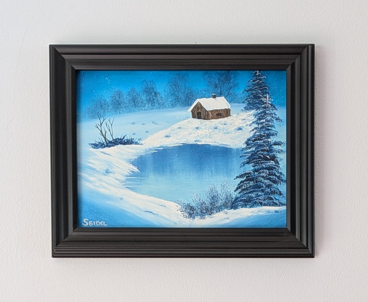 9x12" Original oil painting, snowing, frozen lake, snow drifts, cabin, framed