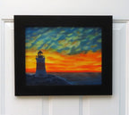 original oil painting of Erie Pierhead light house silhouetted by beautiful sunset and clouds, painted on 11 x 14 canvas panel, framed in modern black frame