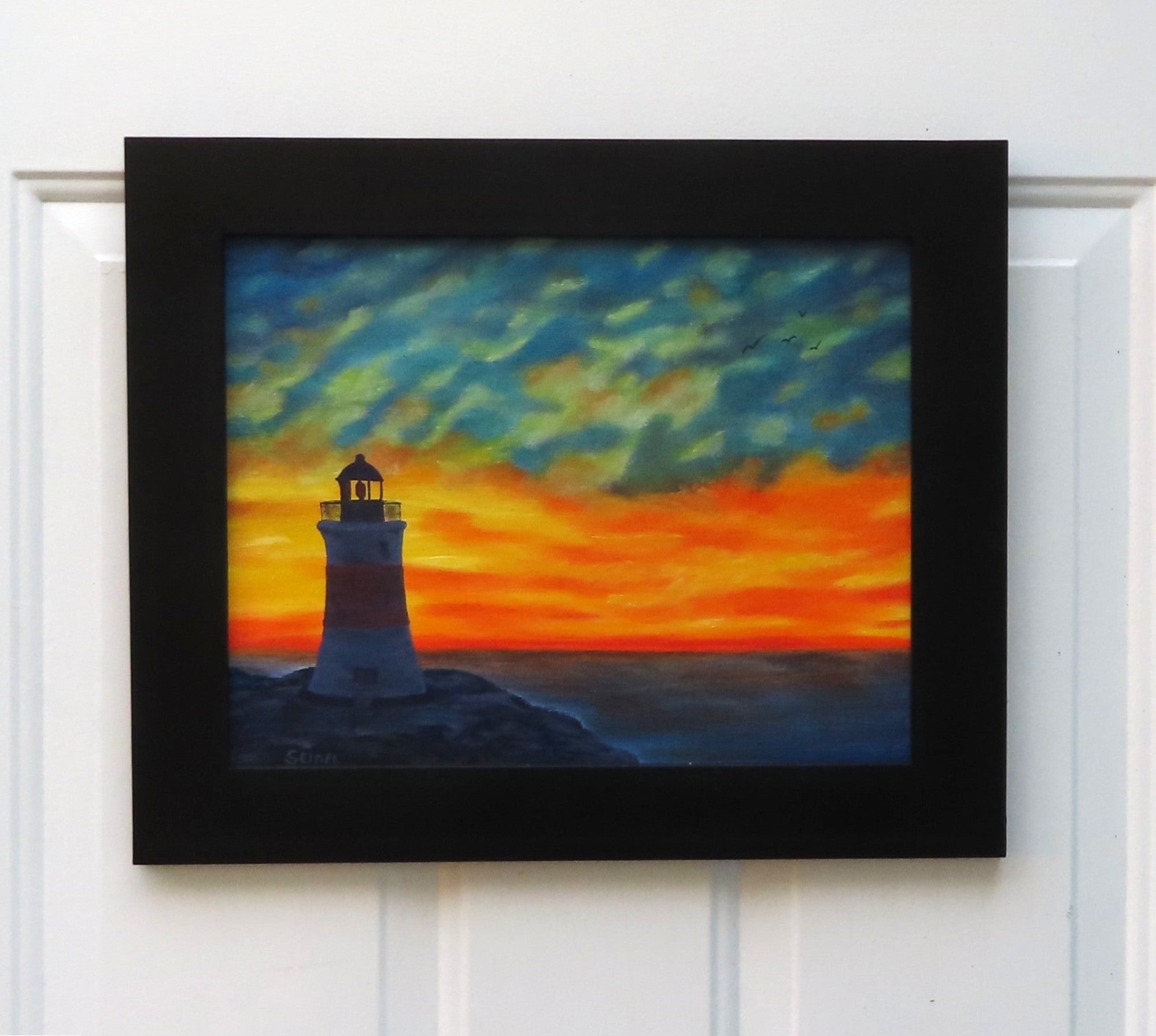 original oil painting of Erie Pierhead light house silhouetted by beautiful sunset and clouds, painted on 11 x 14 canvas panel, framed in modern black frame