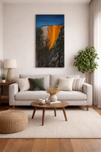 original oil painting on 12x24 vertical canvas brilliant reflection of sunset on Horsetail waterfall in Yosemite National Park displayed over sofa in livingroom