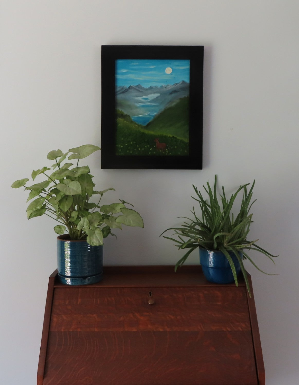 Original oil painting of a misty morning in the mountains, moon, lakes, deer in meadow, framed, displayed over desk