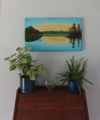 original oil painting on specialty deep cradle canvas, misty lake scene at dawn, fisherman incanoe, pictured over secretary desk