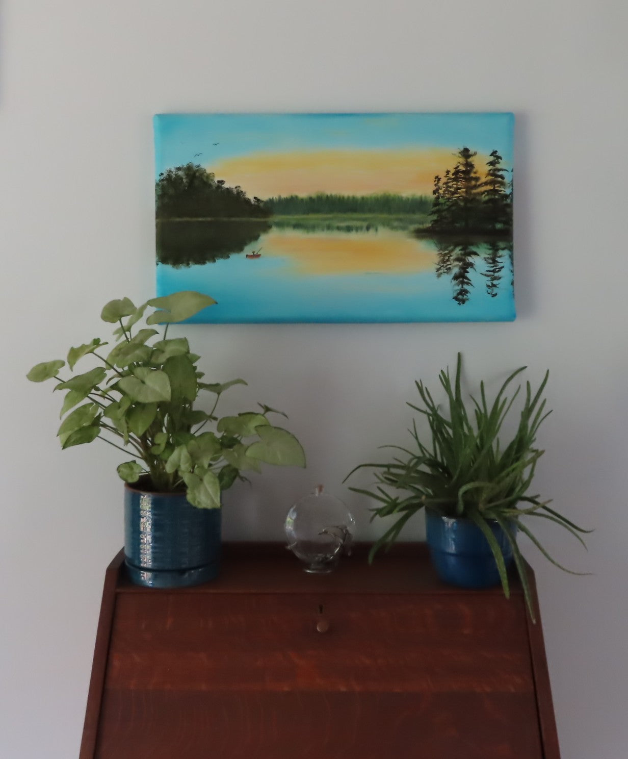 original oil painting on specialty deep cradle canvas, misty lake scene at dawn, fisherman incanoe, pictured over secretary desk