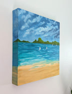 12x12" original oil painting on deep cradle canvas of turquoise ocean, sandy beach with sailboats and mountains in the distance, showing left side