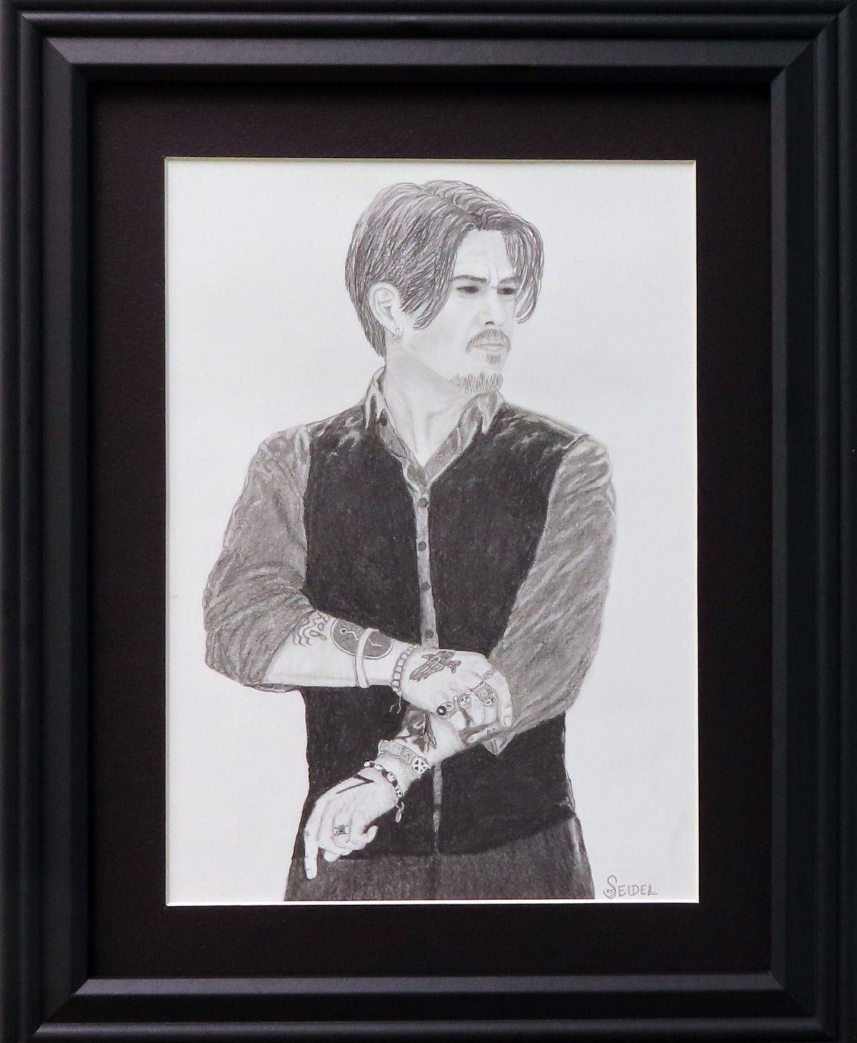9x12" original graphite drawing of Johnny Depp, framed in black, shown on dark background