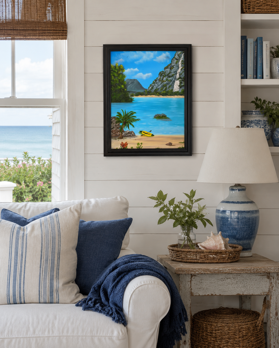 original oil painting of lovely blue water, beach and waterfall surrounding a cove with kayak, framed, displayed in seaside cottage