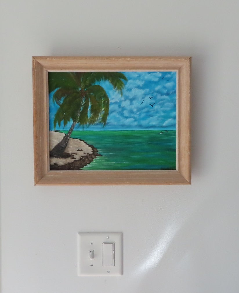 original oil painting of tropical island, kayakers on ocean, palm tree on sandy beach, framed