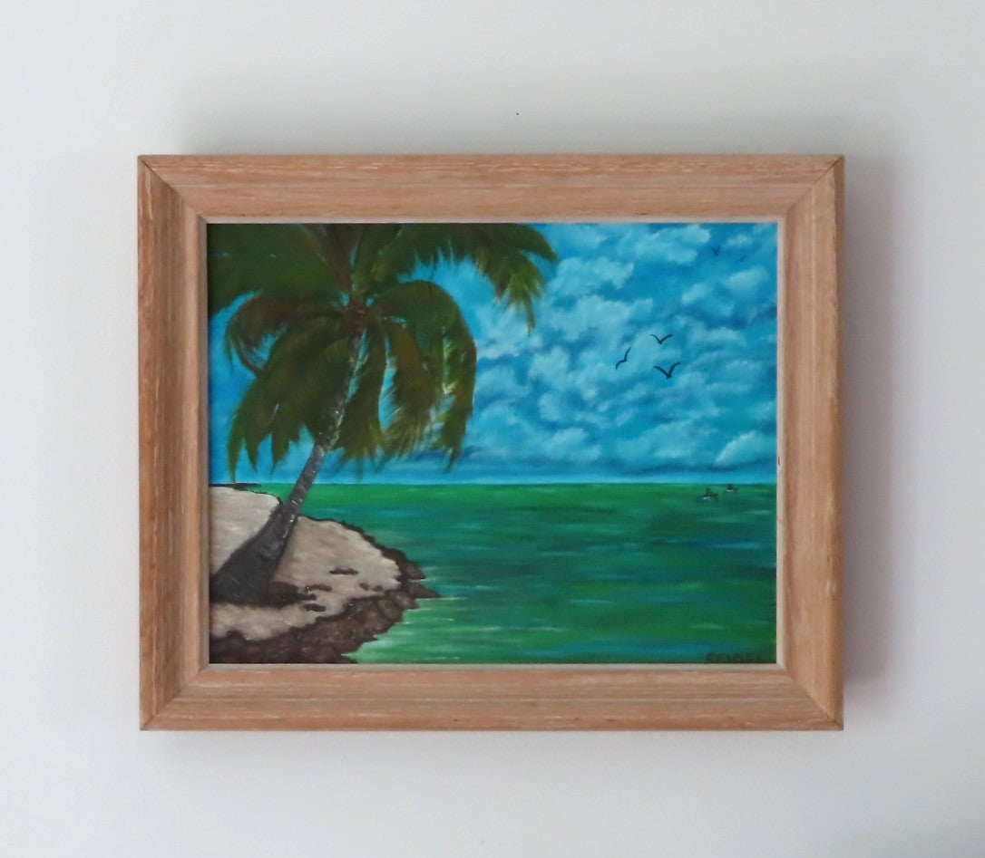 11x14" original oil painting of tropical island, kayakers on ocean, palm tree on sandy beach, shown in heavy oak frame with pickled finish