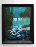 original painting of bright waterfalls and mist contrast with dark woods and rushing river, framed