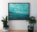Ocean Dreams original abstract  oil painting on 24x30"canvas with beautiful blue, green water, small headlands, clouds in impasto style, handmade black surround frame, displayed over table