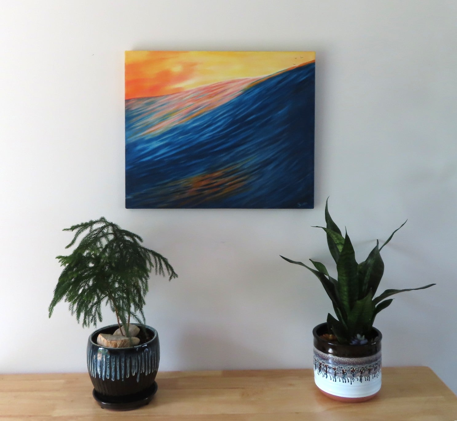 20" tall x 24 wide original oil painting of a single huge colorful ocean wave under a bright sunset sky painted on all sides, pictured over table