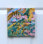 An 8x8" original abstract acrylic painting with multicolored swirls and a textual inspirational quote that reads 'NEVER BE SO OPEN-MINDED THAT YOUR BRAIN FALLS OUT'