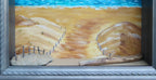 8 1/2 x 10 1/2" by 3" deep shadow box with an original acrylic painting, featuring the Atlantic ocean with sailboats. Mixed media in the foreground features sand a fence and log shown here close-up view.