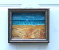8 1/2 x 10 1/2" by 3" deep shadow box with an original acrylic painting, featuring the Atlantic ocean with sailboats. Mixed media in the foreground features sand a fence and log. 