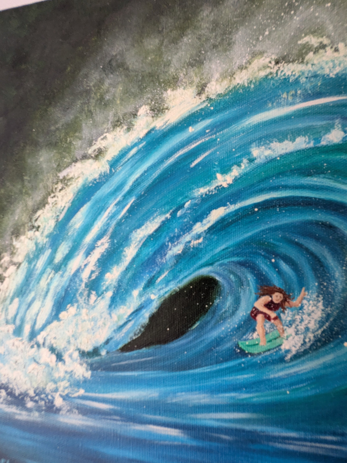 12x12" original oil painting. A close-up of a painted ocean wave scene with a surfer riding inside the curl of a blue wave, with white foam and dark green background.