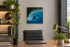 12x12" original oil painting of a surfer in the curl of a huge wave, shown in an office