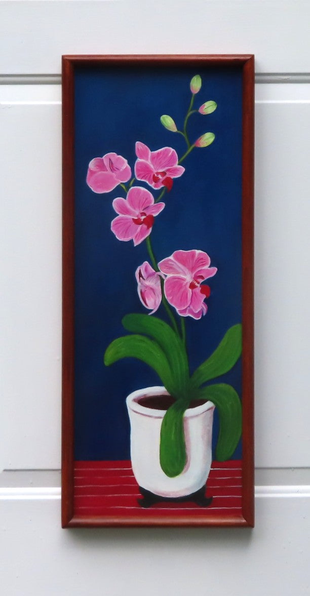 10 1/2x27" original oil painting on board of pink orchids against a royal blue background, in a white pot, framed in a handmade red chestnut colored frame
