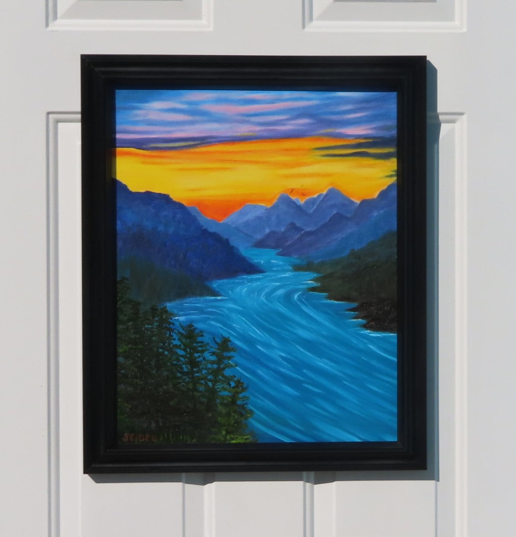 16" wide x 20" tall, original oil painting of river rushing through the mountains under a sunset sky, framed