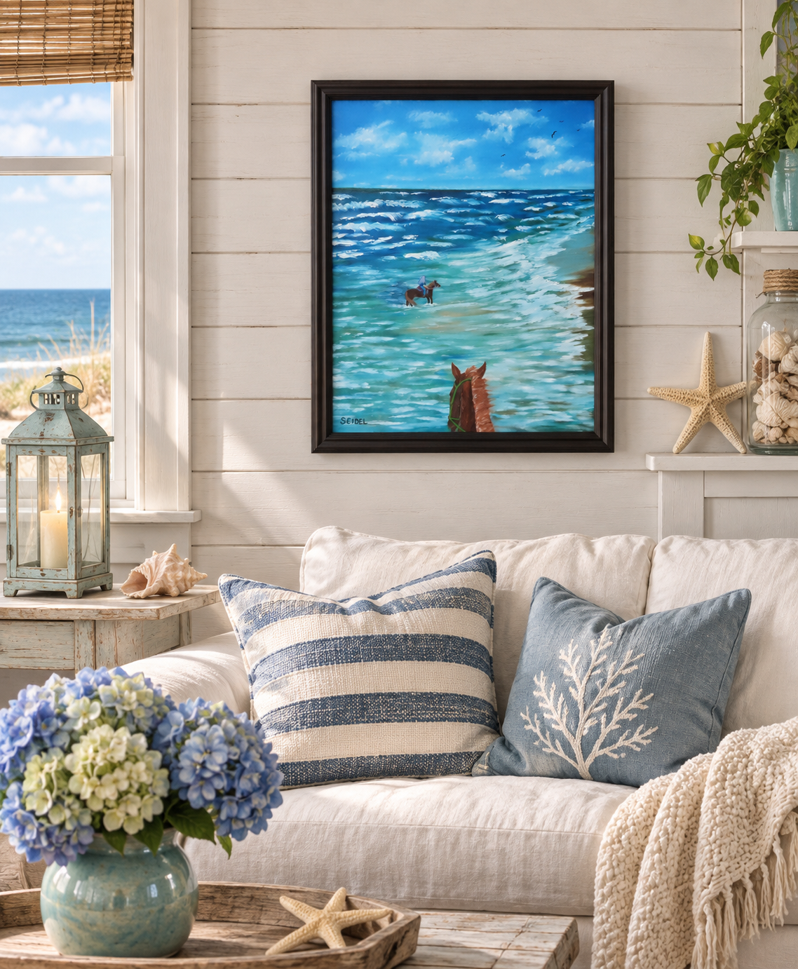 16x20 original oil painting of horseback riders in the ocean close to a beach, displayed in a seaside cottage