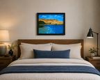 original oil painting of contrasting desert sands meeting the ocean, framed in black displayed over bed