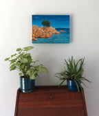 12x16 Original acrylic painting of the island of Sardinia surrounded by ocean, painted on deep cradle canvas, shown over secretary desk