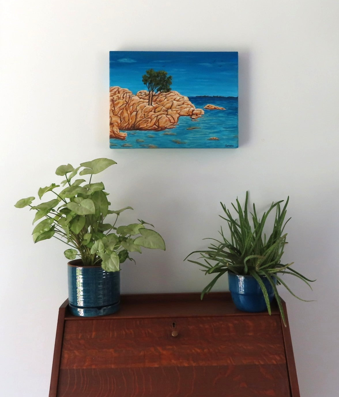 12x16 Original acrylic painting of the island of Sardinia surrounded by ocean, painted on deep cradle canvas, shown over secretary desk