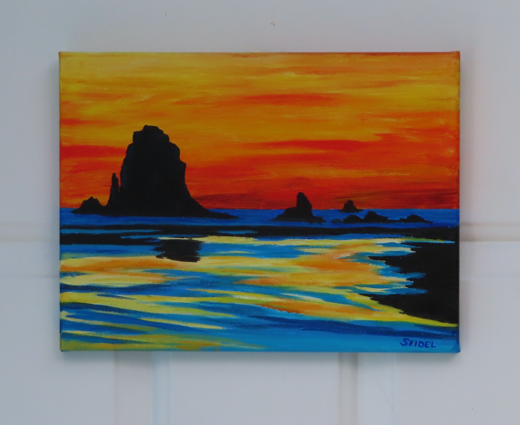 9x12" original acrylic painting, colorful sunset, sea stacks formations off shore, reflections in the tidewaters, unframed