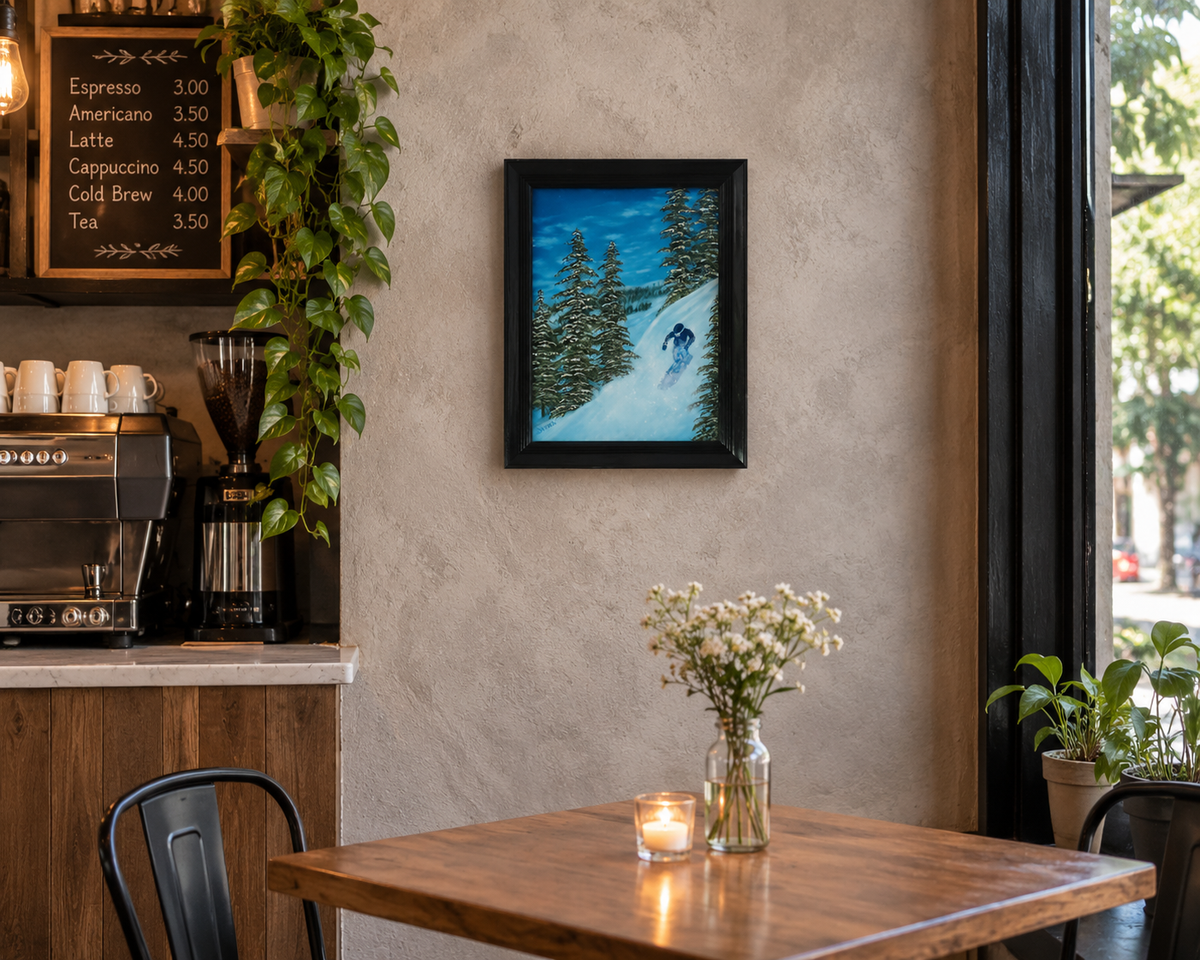  12x16" original oil painting of snowboarder on mountain, displayed in acafe