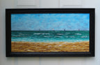 12x24 original oil painting of ocean, waves, sailboats, paragliders, and sandy beach, framed in black