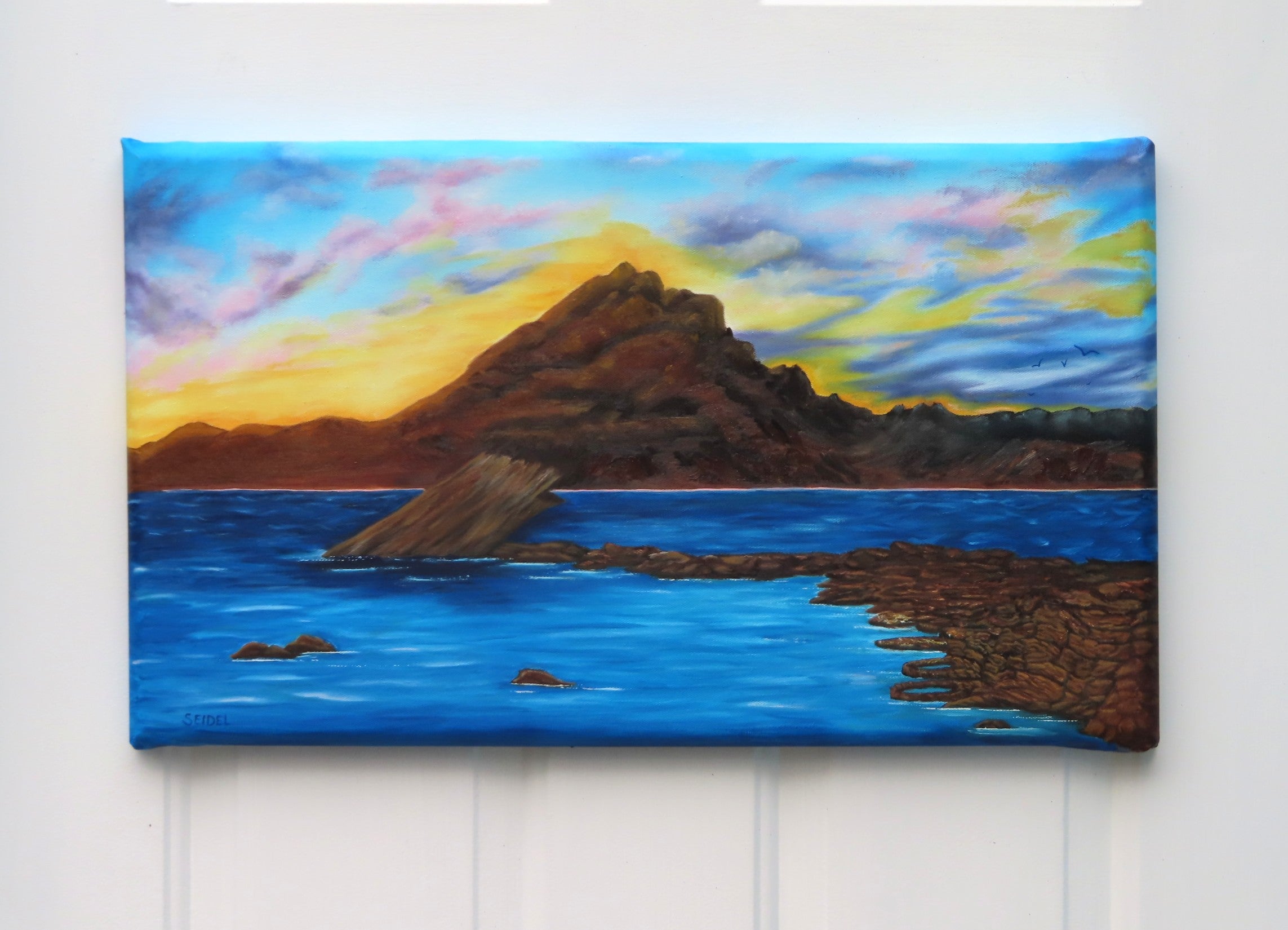 original oil painting, 14x24 beveled canvas, delicate pastel clouds in evening sky, contrasted by bold textured mountains and shadowed waters