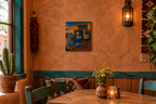 12 1/2 x 14" Original oil painting on wood, mixed media, 3 dimensional, painting continues onto frame, shown in a southwest cafe