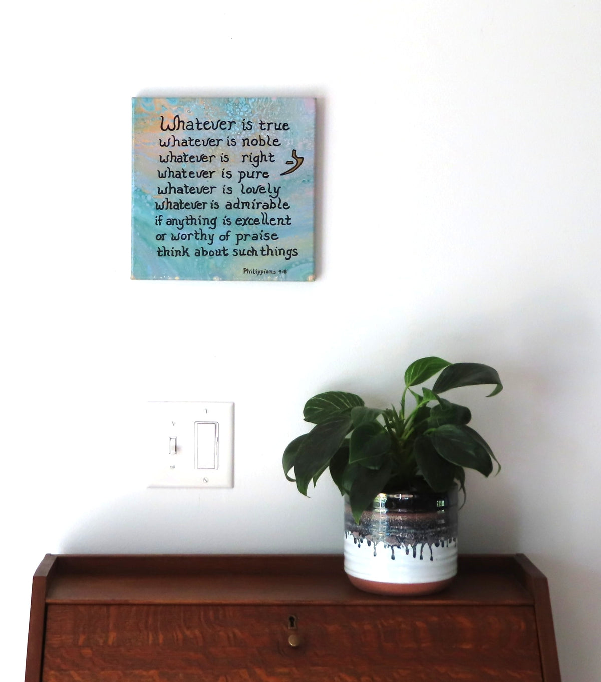 10x10" original liquid acrylic painting on canvas, multiple blues and peach colors with an inspirational scripture, shown over a secretary desk