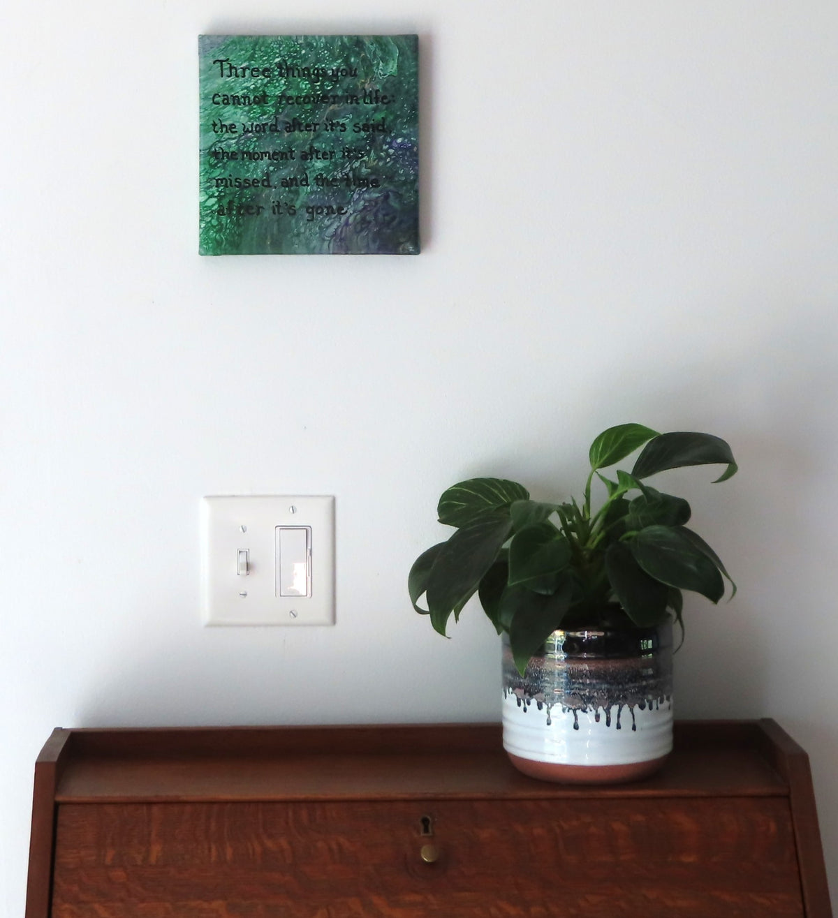 8x8" canvas with liquid art acrylic and inspirational quote. Colors are multiple greens with purple and gold accents, shown over a secretary desk